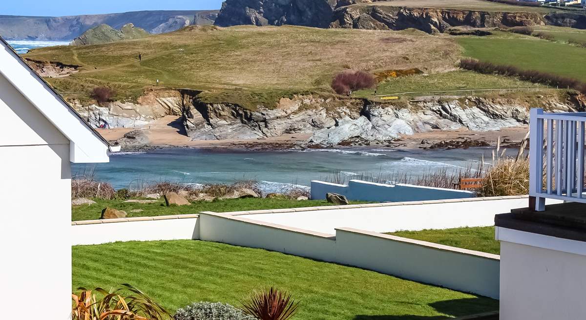 The balcony overlooks the decking area and shared lawn and from the side of the balcony you can see Porth beach. 