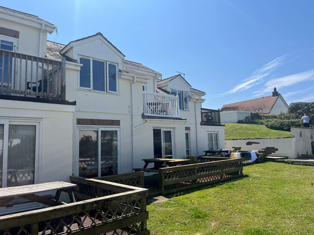 The lovely decked area at Puffin is accessed from the bedrooms.