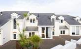 Puffin is a two-storey house, in a small horseshoe of 15 properties, nestled above the beach. You can access the property either via a ramp or flight of steps. The parking bay is a short walk away from the property.  - Thumbnail Image