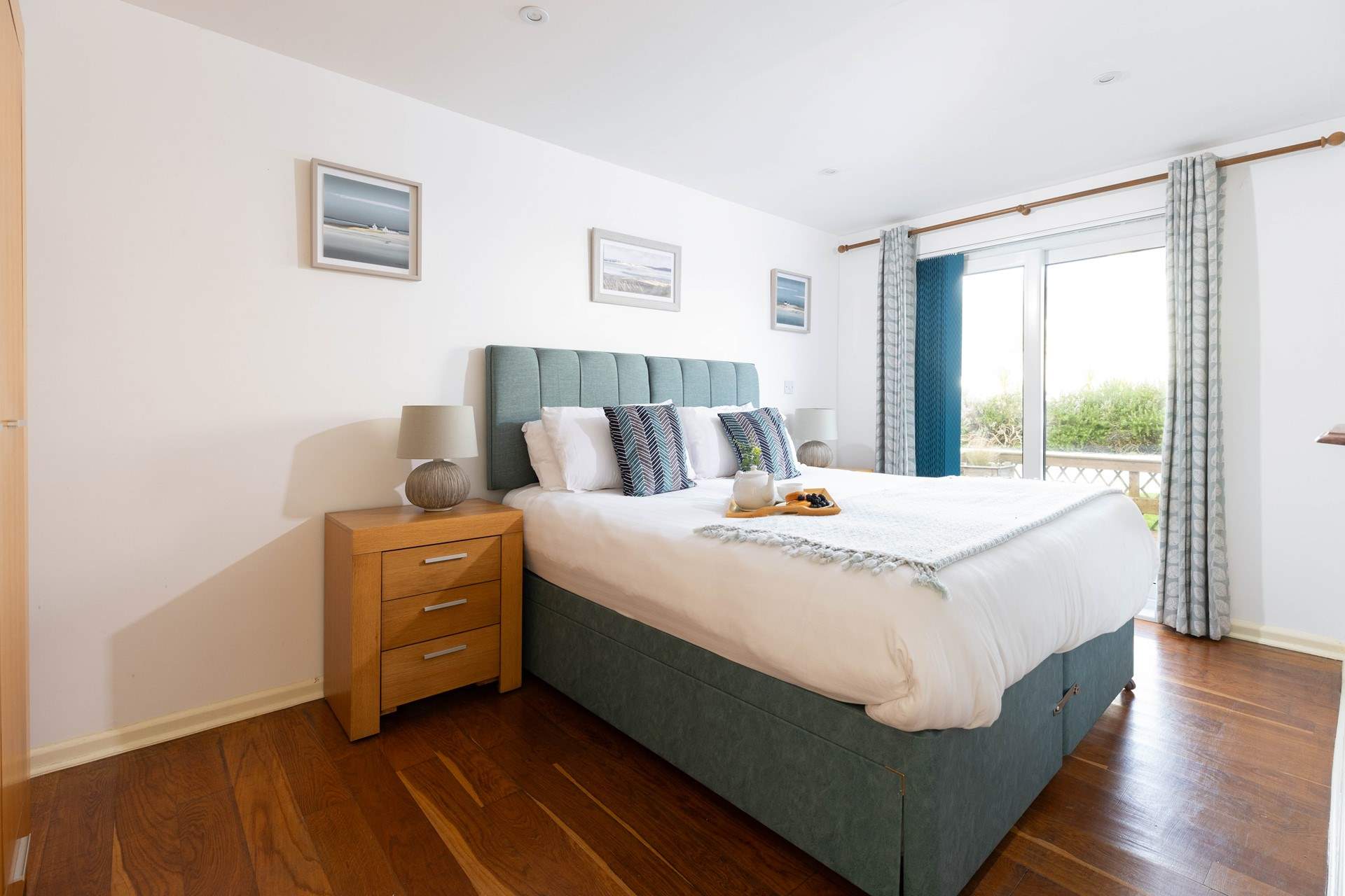 This large bedroom is decorated in calming blues. It over looks the decking with French doors that open directly to it, perfect for those summer mornings (Bedroom 2). 
