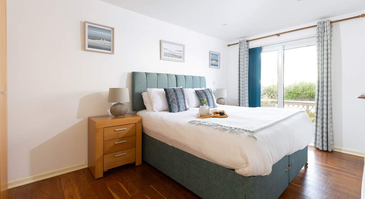 This large bedroom is decorated in calming blues. It over looks the decking with French doors that open directly to it, perfect for those summer mornings (Bedroom 2). 