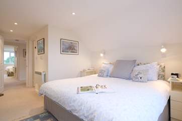 Bedroom 1 at the front of the house has a super-king size bed and views of the sea.