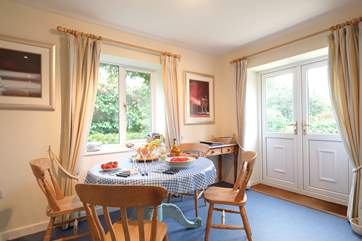 French doors from the kitchen/dining-room lead out to the rear garden.