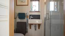Complete with walk-in shower, wash-basin and WC.