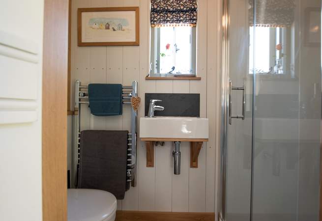Complete with walk-in shower, wash-basin and WC.