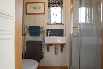 Complete with walk-in shower, wash-basin and WC.