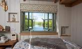 The lake views can even be enjoyed from the bed - the perfect accompaniment to a morning cuppa. - Thumbnail Image