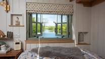 The lake views can even be enjoyed from the bed - the perfect accompaniment to a morning cuppa.