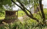 There's a rustic outdoor kitchen behind the hut.  - Thumbnail Image