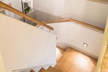 The staircase which links both floors is fully equipped with spot lighting to ensure safe travels.