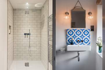 The en suite to Bedroom 5 is equipped with a large shower cubicle with tasteful design throughout.