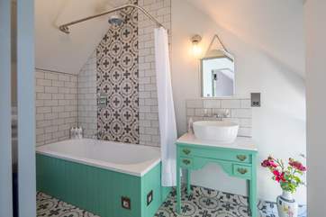 The annexe bathroom is both charming and elegant.