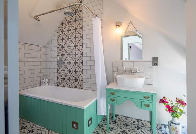 The annexe bathroom is both charming and elegant.