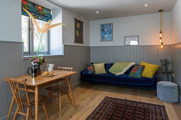The annexe sitting and dining area is so charming and designed with every last detail in mind.