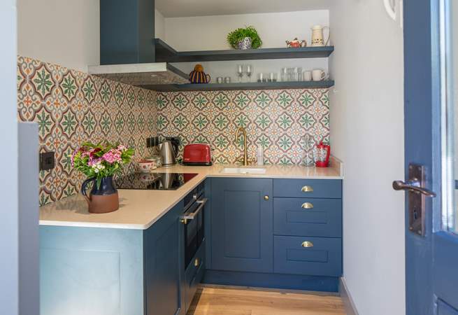 Step into this compact and well-equipped kitchen. Perfect for whipping up breakfast for two.