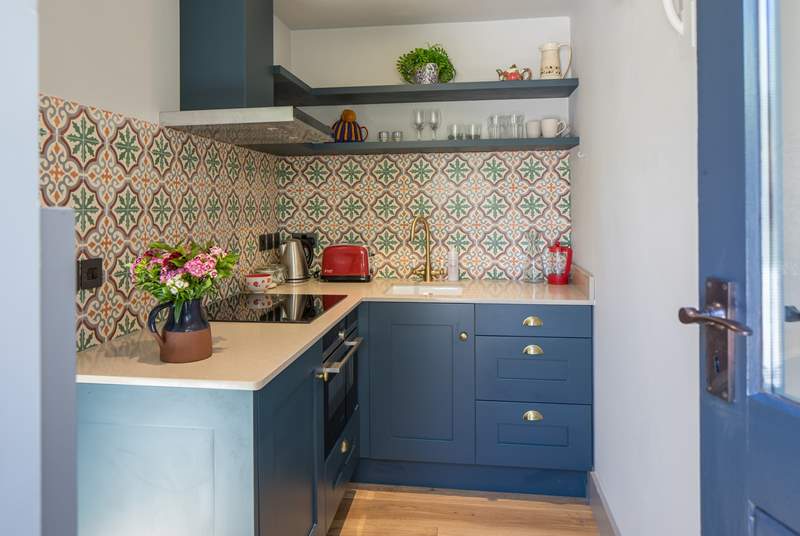 Step into this compact and well-equipped kitchen. Perfect for whipping up breakfast for two.