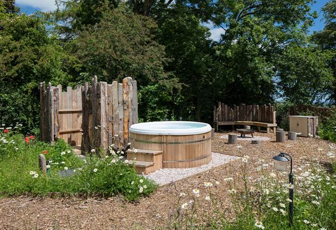 This fabulous area is the perfect setting for the bubbling hot tub and secluded fire-pit area. The wildflowers set the scene perfectly for this beautiful and tranquil spot.