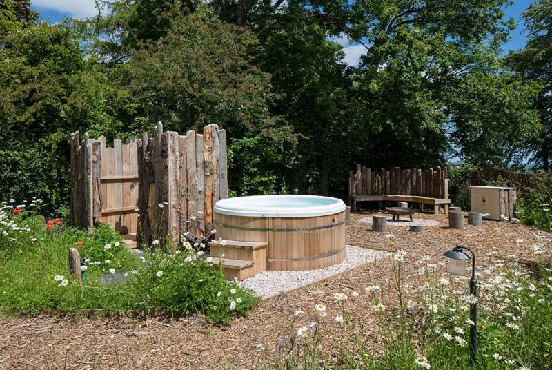 This fabulous area is the perfect setting for the bubbling hot tub and secluded fire-pit area. The wildflowers set the scene perfectly for this beautiful and tranquil spot.