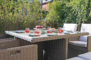 There is not only this patio area to the front and side of the property, but a decked area to the rear as well