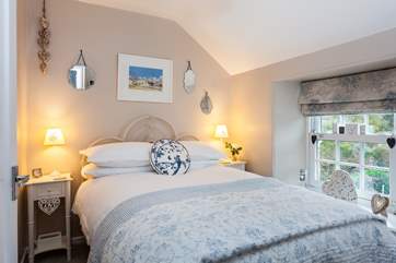 Luxurious bedding and a high finish in the master bedroom.