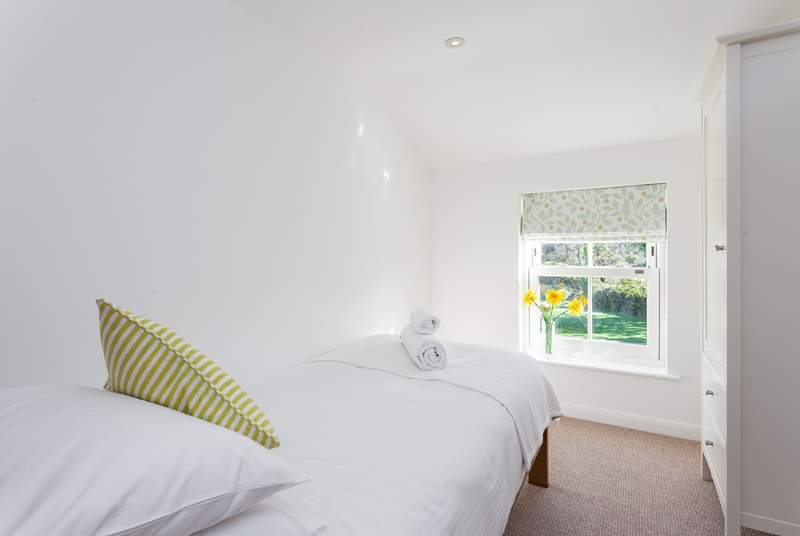 Bedroom 4 with single bed overlooks the sunny rear garden.