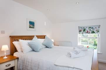 The master bedroom has a king-size bed and en suite shower-room.