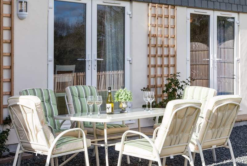 The sunny patio is the perfect spot for a glass of wine.