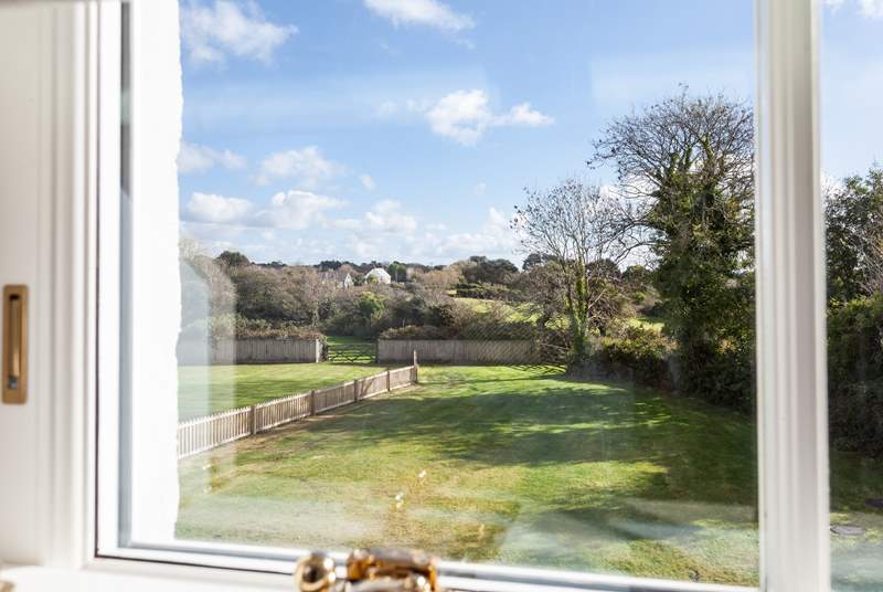 Bedroom 4 has a fabulous view of the rear garden and rolling fields. The property next door is Lynwood.