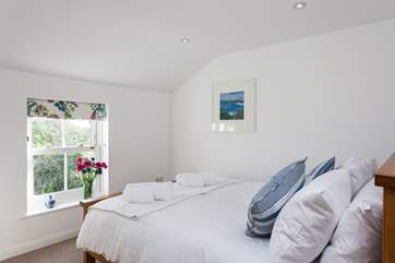 Bedroom 2 has a double bed, and has views of the garden.