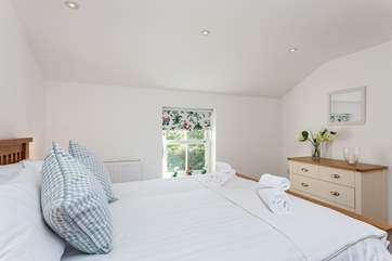 The very pretty master bedroom.