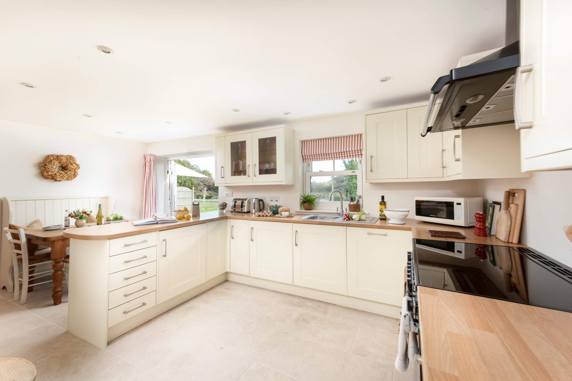 The beautifully crafted kitchen is perfect for sociable dining. 