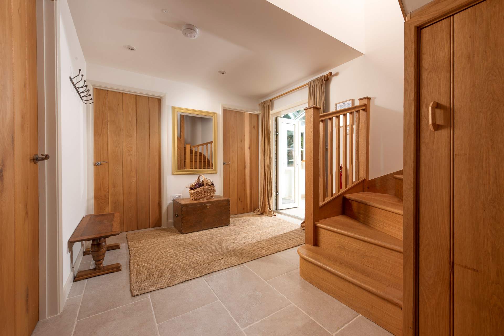 The light-filled hallway with beautifully crafted oak timber.