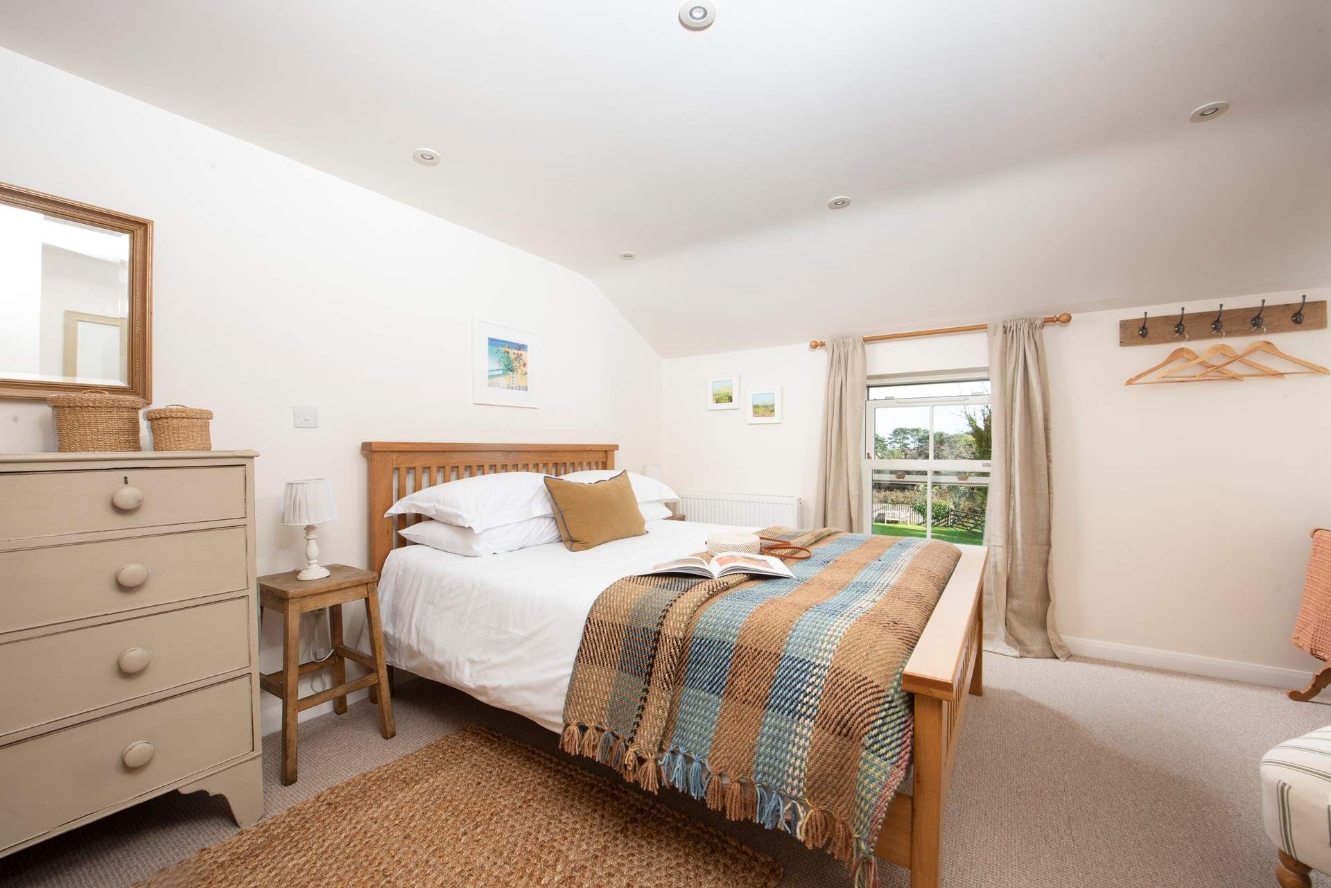 Spacious king-size bedroom 1 has a modern farmhouse feel..