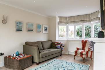 Cosy up in this comfortable sitting-room with a movie of your choice.