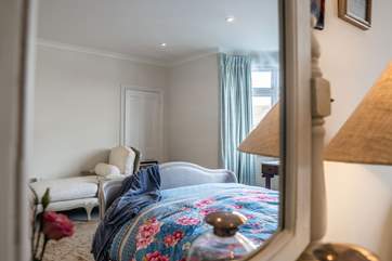 The master bedroom has a feeling of luxury.