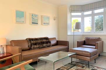 Cosy up in this comfortable sitting-room with a movie of your choice.