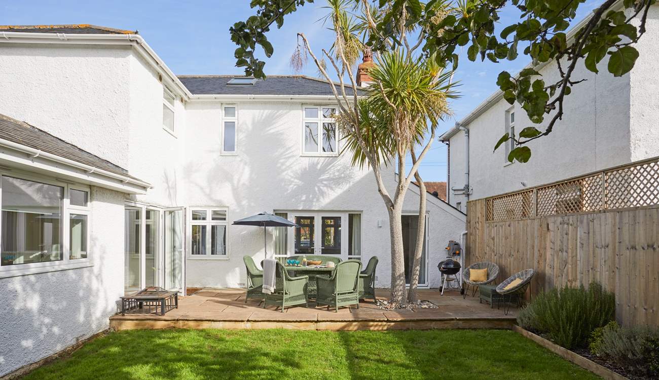 A lovely enclosed garden that everyone will enjoy spending time in.