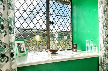 Trinkets and historic family photos are displayed throughout, evidence that this was a real family home.