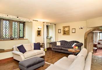 The drawing-room is packed full of character features, with mullioned windows, wood-burning stove, parquet and flagstone flooring and granite archways flooring.
