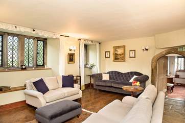 The drawing-room is packed full of character features, with mullioned windows, wood-burning stove, parquet and flagstone flooring and granite archways flooring.