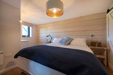 Open the sliding doors to reveal the delightful bedroom, with its sumptious super king-size bed! (this can also be made up as twin beds)