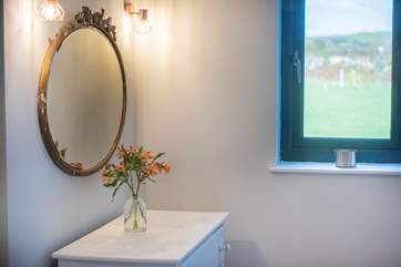 This beautiful mirror is set above the chest of drawers in the bedroom.
