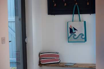 There are handy hooks for your coats and jackets by the door, as well as a bench for when popping your walking boots on and off.