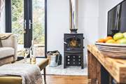Get cosy on the sofa in front of the wood-burner. 
