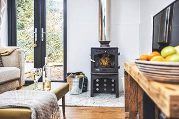 Get cosy on the sofa in front of the wood-burner.