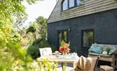 French doors lead from the living-room out to the decking - dining al fresco is a must. - Thumbnail Image