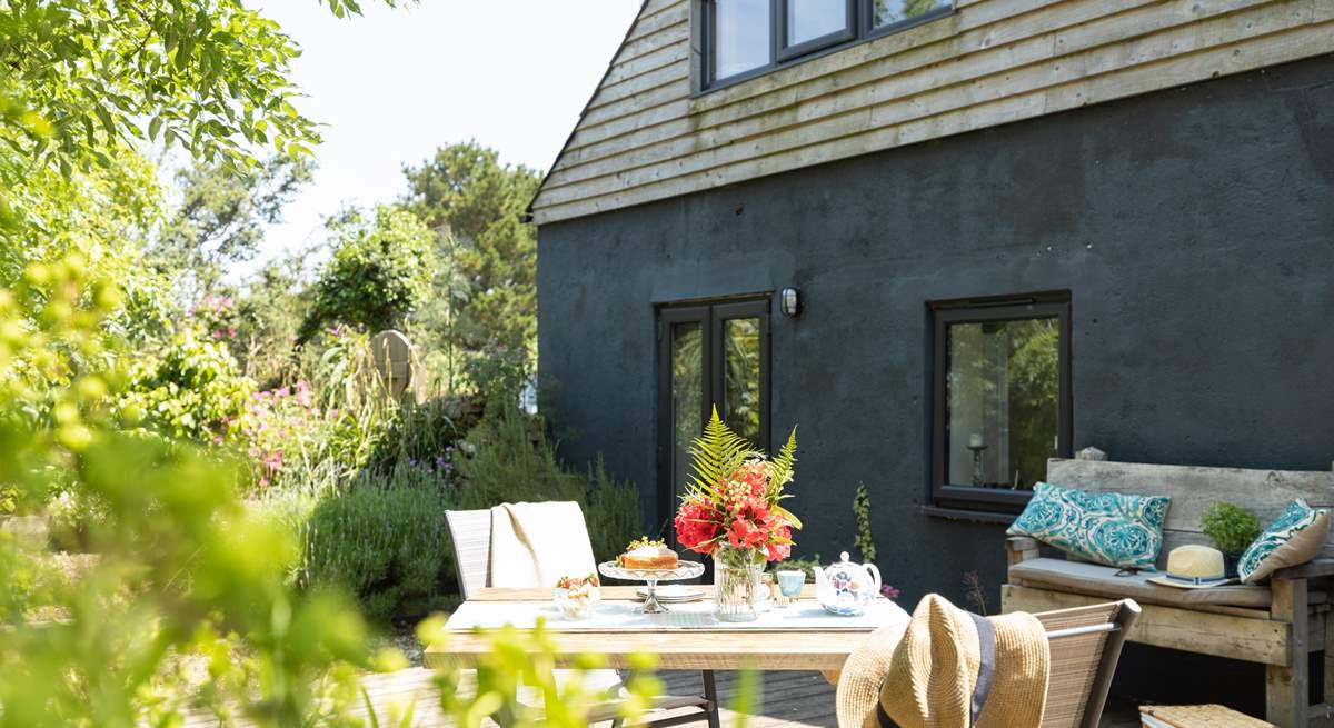 French doors lead from the living-room out to the decking - dining al fresco is a must.