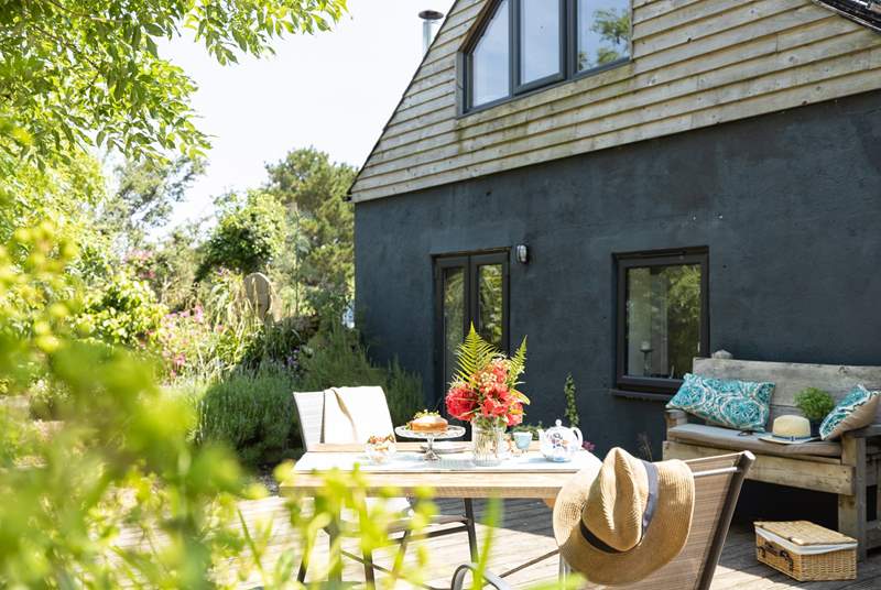 French doors lead from the living-room out to the decking - dining al fresco is a must.