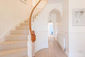 The generous entrance hall is full of character