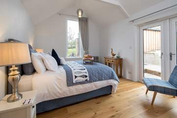 The bedroom is light and airy, yet super inviting.